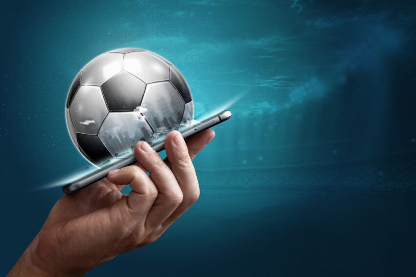 Smartphone,In,Hand,With,A,3d,Soccer,Ball,On,A Sistema de Roll Over revela valor do bonus sem deposito